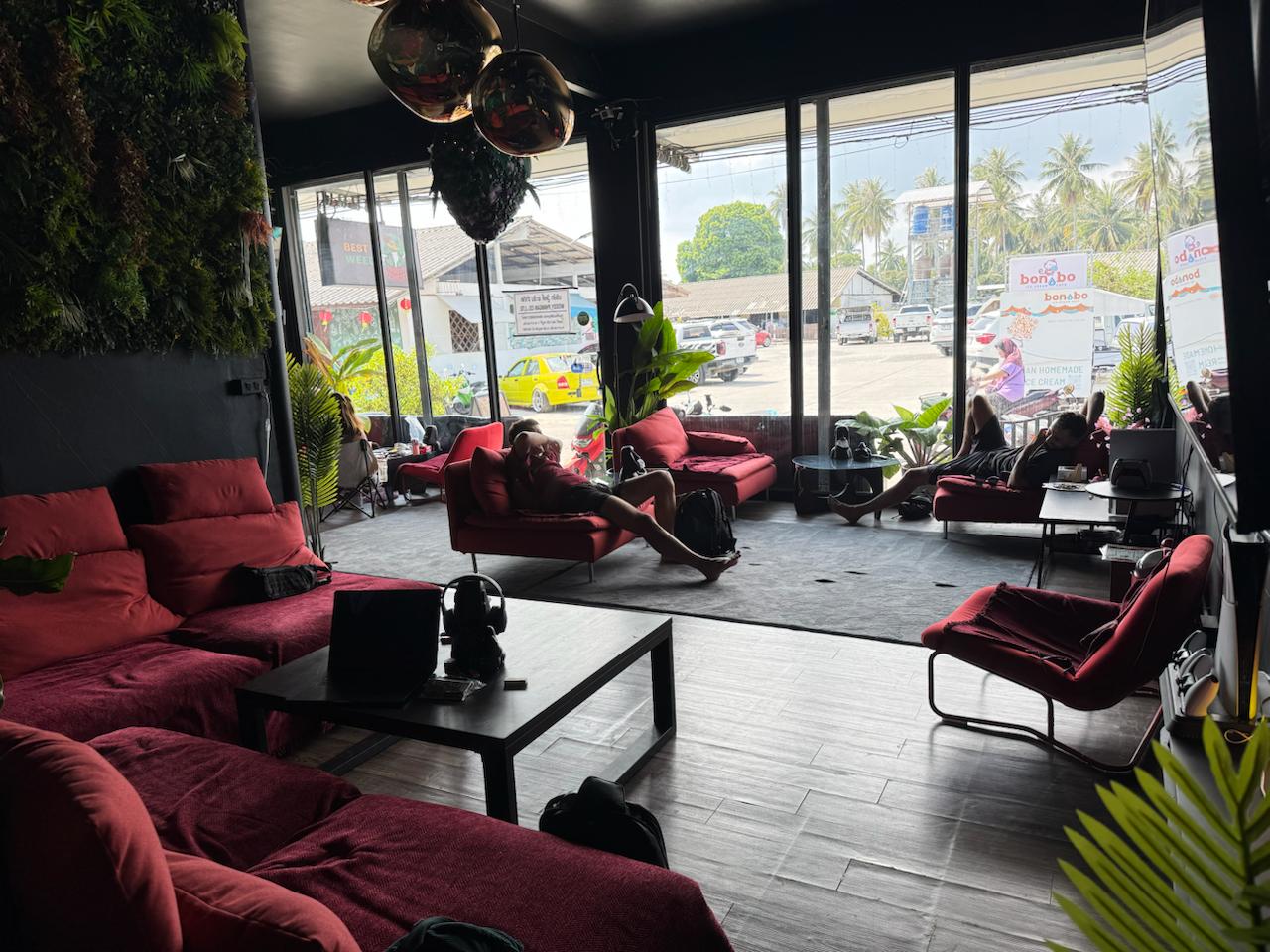 Chill zone — low lights, real couches, island pace